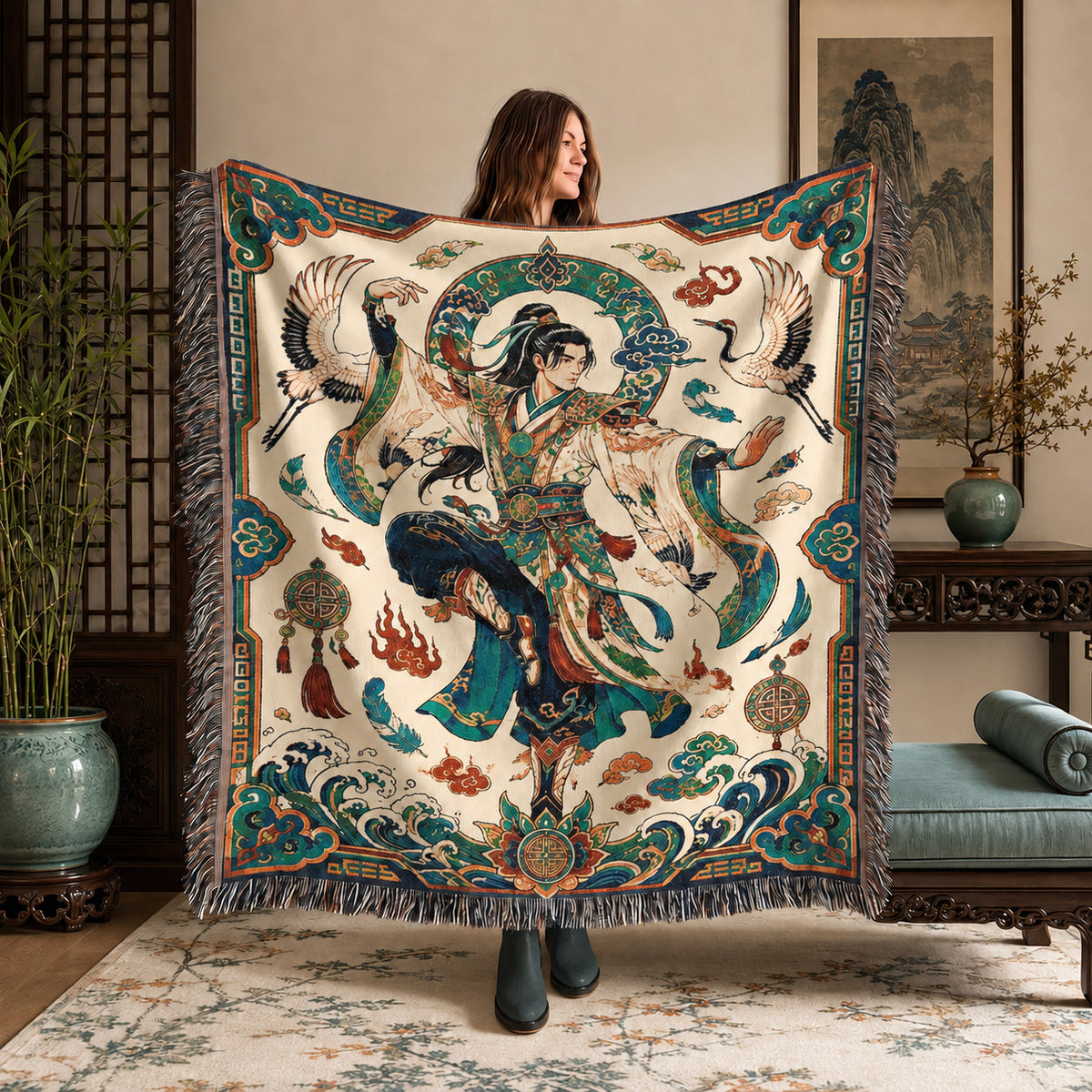 Person holding a Chinese inspired woven blanket featuring a male warrior, cranes, clouds and ocean waves